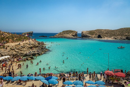 People at the Blue Lagoon in Comino Island - Gozo, Malta