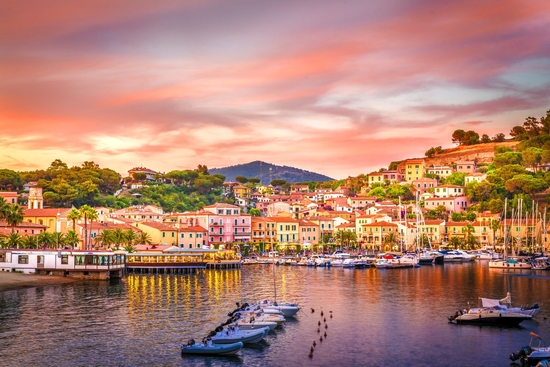 Harbor and village Porto Azzurro at sunset, Elba islands, Tuscany, Italy.